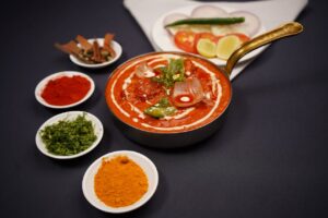 Delicious Indian curry with vibrant spices and herbs, beautifully arranged in a bowl.